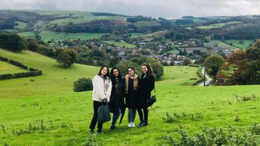 Four female international students in the countryside